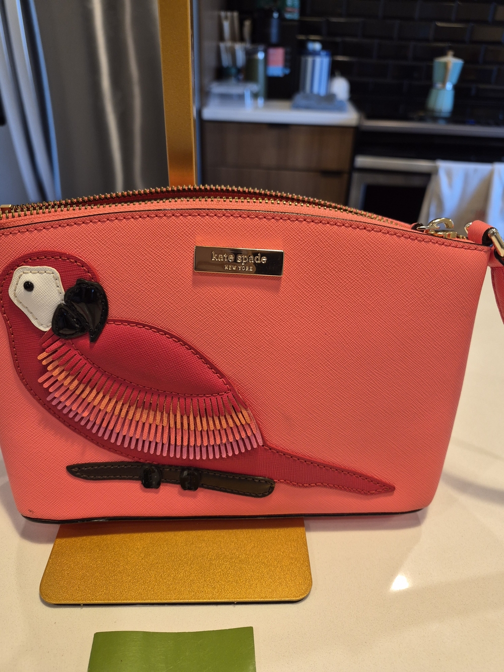 Kate Spade New York "Talk the Talk" Millie Parrot Crossbody Bag in coral pink
